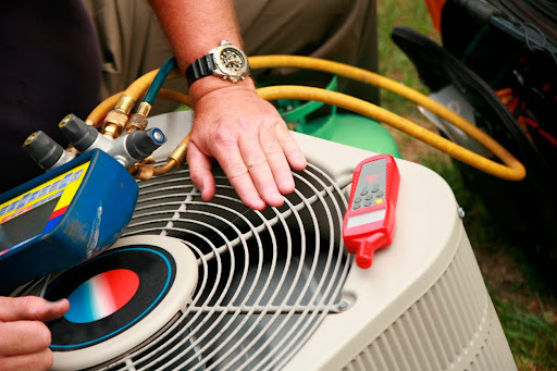 Close-up of air conditioning unit being serviced with diagnostic equipment.