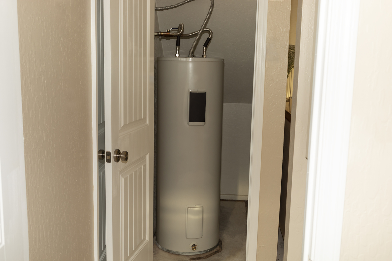  75-gallon automatic storage water heater in a storeroom in a house.